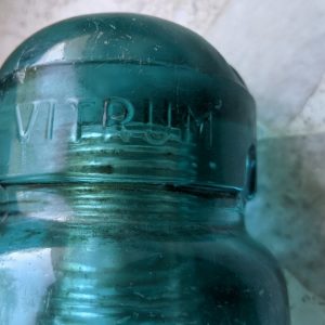 old glass insulator with rare embossing - Vitrum